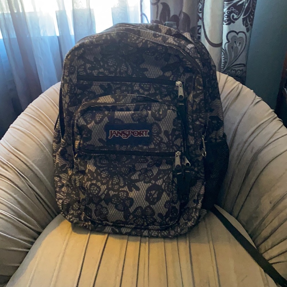 Jansport Backpack. Black/grey. Floral & lace pattern. Excellent condition.